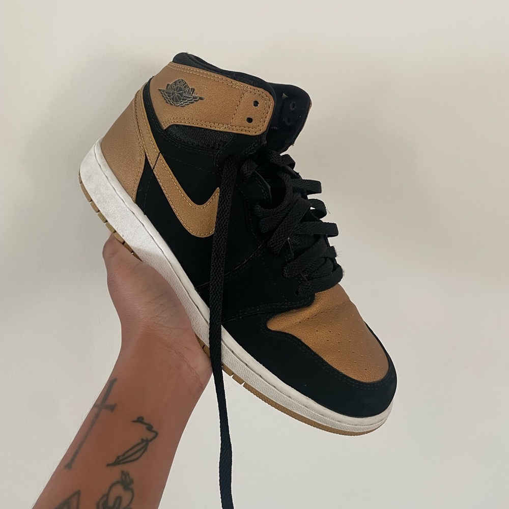 Air Jordan 1 Retro ‘High’ Melo black and gold sneaker